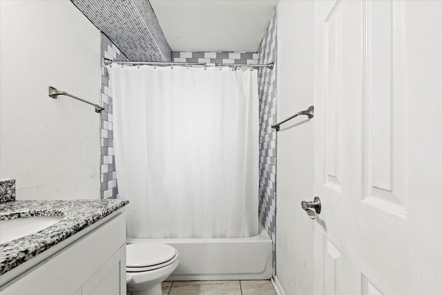 full bathroom featuring tile patterned floors, vanity, toilet, and shower / bath combo with shower curtain