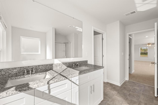 1257 Birch Cir, Grovetown, GA 30813 - full bathroom with baseboards, double vanity, a shower stall, and ceiling fan