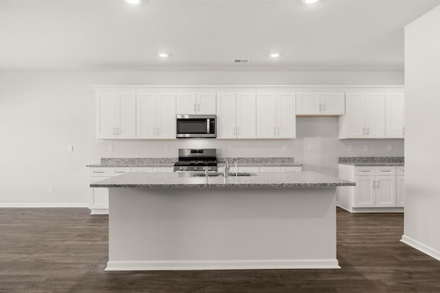 1257 Birch Cir, Grovetown, GA 30813 - kitchen featuring appliances with stainless steel finishes, white cabinetry, light stone countertops, and recessed lighting