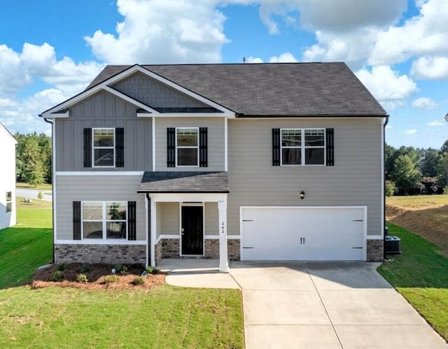 1257 Birch Cir, Grovetown, GA 30813 - craftsman house featuring a garage, driveway, board and batten siding, a front yard, and stone siding