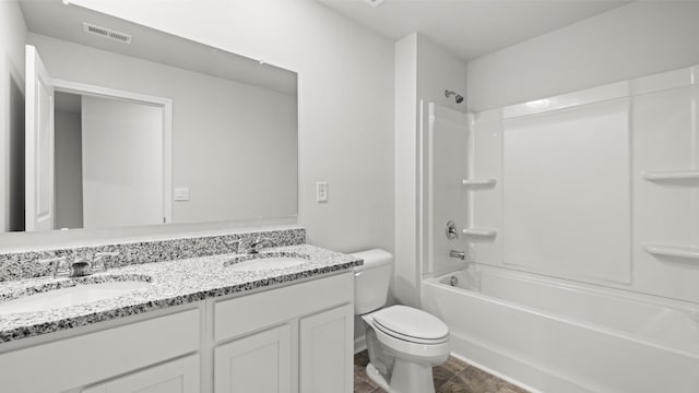 full bath with toilet, a sink, double vanity, and visible vents