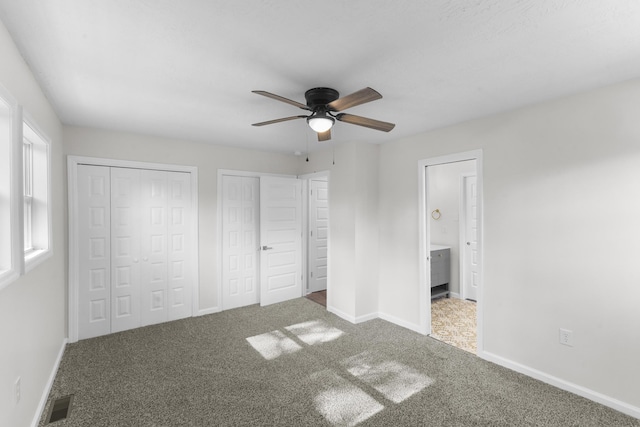 319 Indian Trl, Augusta, GA 30907 - unfurnished bedroom featuring two closets, carpet floors, and baseboards