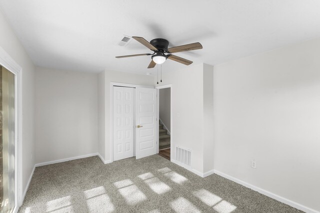 319 Indian Trl, Augusta, GA 30907 - unfurnished bedroom with a closet, baseboards, carpet flooring, and a ceiling fan