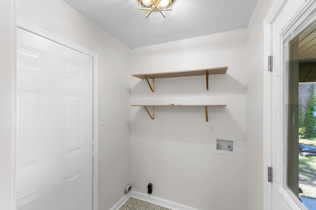 319 Indian Trl, Augusta, GA 30907 - laundry area featuring washer hookup, baseboards, and a textured ceiling
