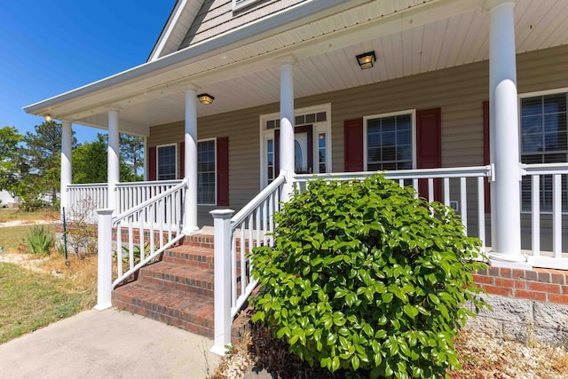 property entrance featuring covered porch