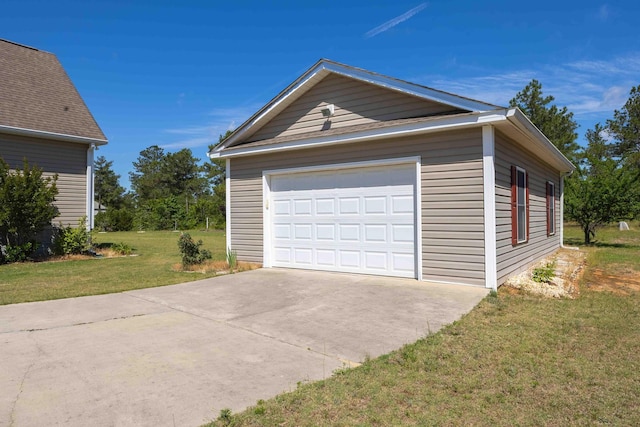 detached garage with concrete driveway