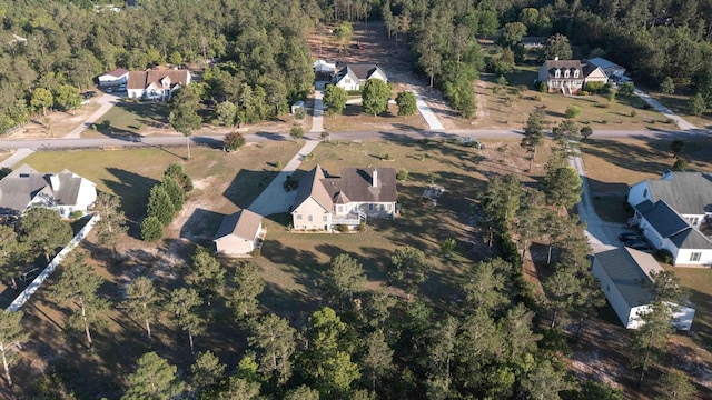 view of property location featuring a heavily wooded area