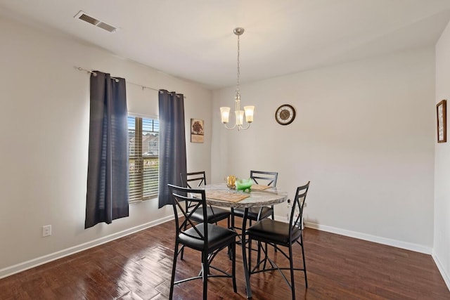 108 Sims Ct, Augusta, GA 30909 - dining area with dark wood-style flooring and a chandelier