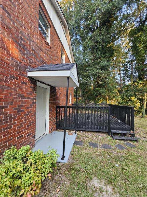 view of yard featuring a wooden deck