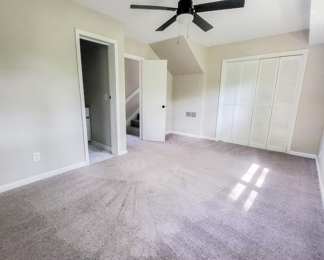 bonus room featuring ceiling fan and light colored carpet