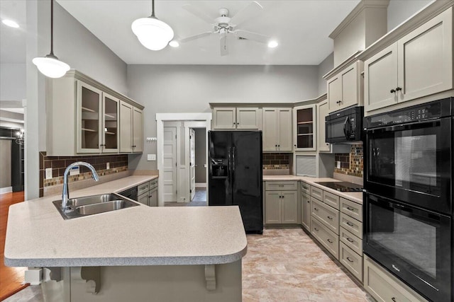 459 Sebastian Dr, Grovetown, GA 30813 - kitchen with black appliances, a peninsula, decorative backsplash, glass insert cabinets, and recessed lighting