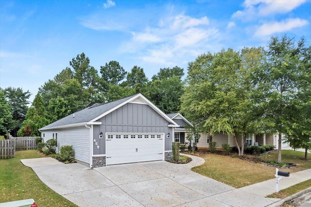 459 Sebastian Dr, Grovetown, GA 30813 - view of front of property featuring board and batten siding, driveway, a garage, and stone siding