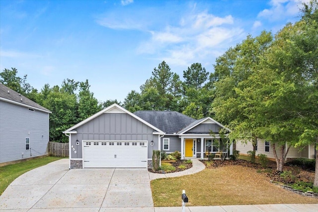 459 Sebastian Dr, Grovetown, GA 30813 - ranch-style house with board and batten siding, an attached garage, concrete driveway, and covered porch