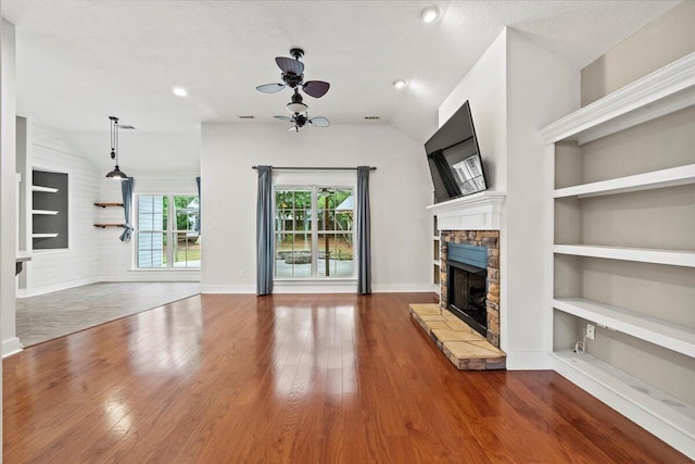 459 Sebastian Dr, Grovetown, GA 30813 - unfurnished living room with ceiling fan, a stone fireplace, wood finished floors, built in features, and recessed lighting