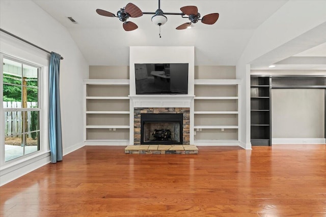 459 Sebastian Dr, Grovetown, GA 30813 - unfurnished living room featuring vaulted ceiling, ceiling fan, wood finished floors, and a stone fireplace
