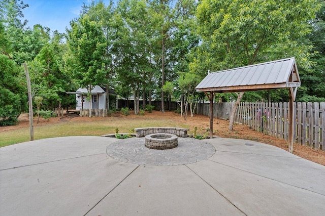 459 Sebastian Dr, Grovetown, GA 30813 - fenced backyard featuring an outdoor fire pit, a patio area, and an outbuilding