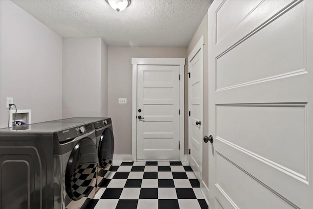 459 Sebastian Dr, Grovetown, GA 30813 - washroom with dark floors, washing machine and clothes dryer, and a textured ceiling