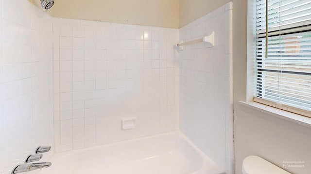 full bathroom featuring toilet and shower / bathtub combination