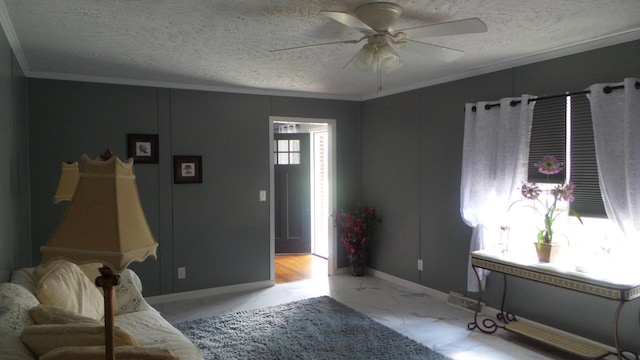 living room with a textured ceiling, plenty of natural light, ceiling fan, and crown molding