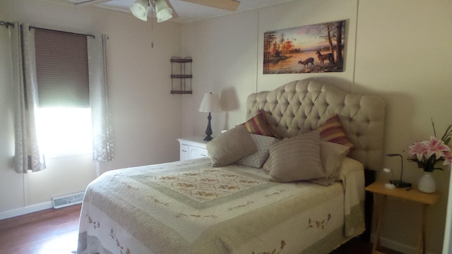 bedroom featuring hardwood / wood-style floors and ceiling fan