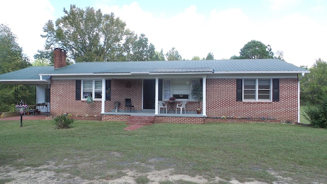 ranch-style house featuring a porch and a front lawn