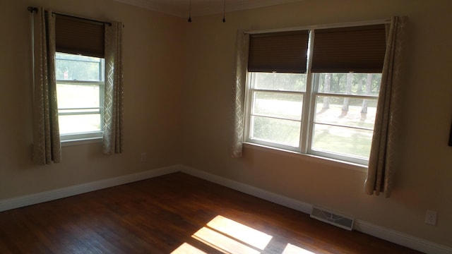 empty room with dark hardwood / wood-style floors