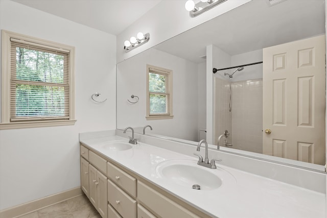 4119 N Knollcrest Cir, Martinez, GA 30907 - full bathroom with double vanity, healthy amount of natural light, baseboards, and a shower