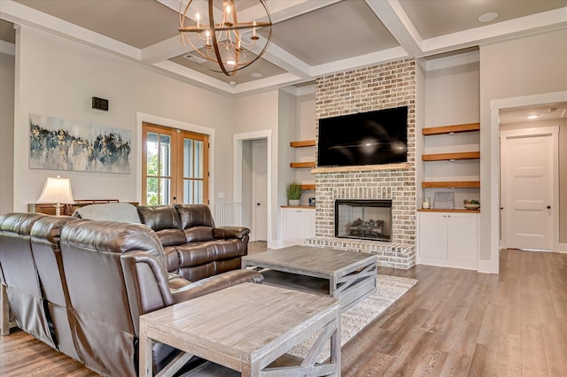 2550 Otts Ln, Harlem, GA 30814 - living room with coffered ceiling, a chandelier, wood finished floors, a fireplace, and beamed ceiling