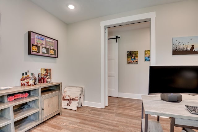 2550 Otts Ln, Harlem, GA 30814 - office area with light wood finished floors, a barn door, and recessed lighting