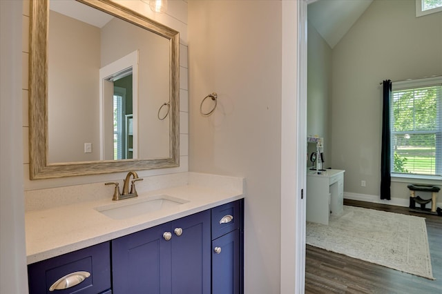 2550 Otts Ln, Harlem, GA 30814 - bathroom featuring wood finished floors, vanity, and lofted ceiling