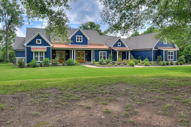 2550 Otts Ln, Harlem, GA 30814 - view of front facade with french doors, a front lawn, a standing seam roof, and a metal roof