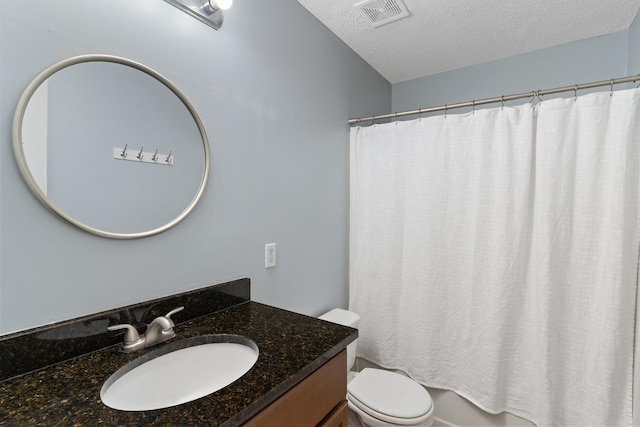 222 Canterbury Dr, Wrens, GA 30833 - bathroom featuring vanity, a textured ceiling, and shower / tub combo with curtain