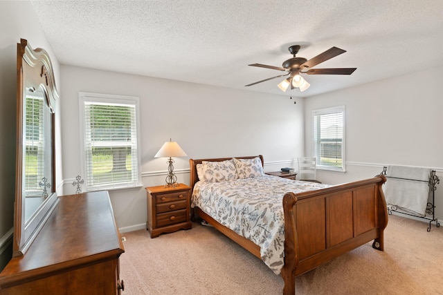 222 Canterbury Dr, Wrens, GA 30833 - bedroom with light carpet, a textured ceiling, and a ceiling fan