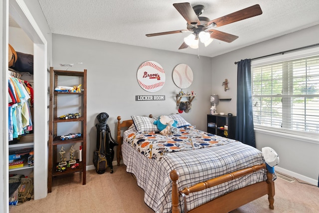 222 Canterbury Dr, Wrens, GA 30833 - bedroom featuring carpet flooring, ceiling fan, and a textured ceiling