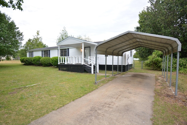 view of front of property with a front yard, a carport, and covered porch