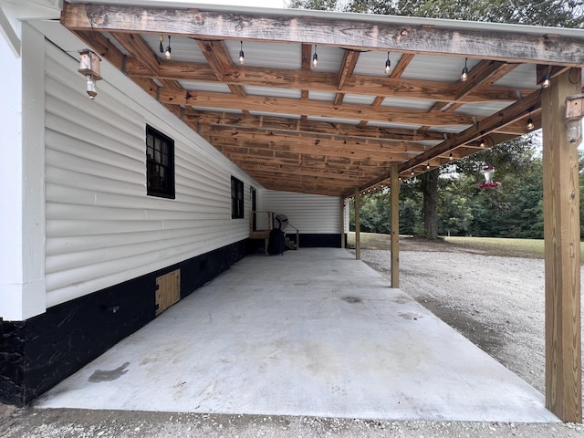2786 Tudor Rd, Dearing, GA 30808 - view of patio / terrace featuring an attached carport