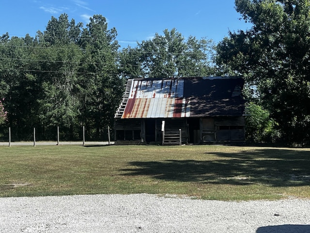 2786 Tudor Rd, Dearing, GA 30808 - view of front of property with a front yard, a barn, and an outdoor structure