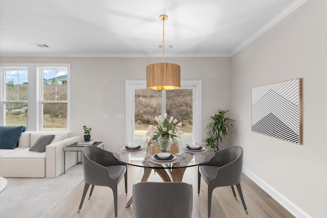 kitchen with appliances with stainless steel finishes, decorative light fixtures, white cabinetry, and sink