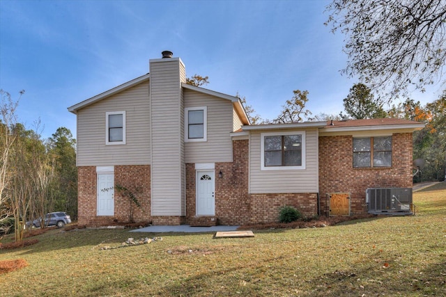 exterior space featuring a front lawn and central air condition unit