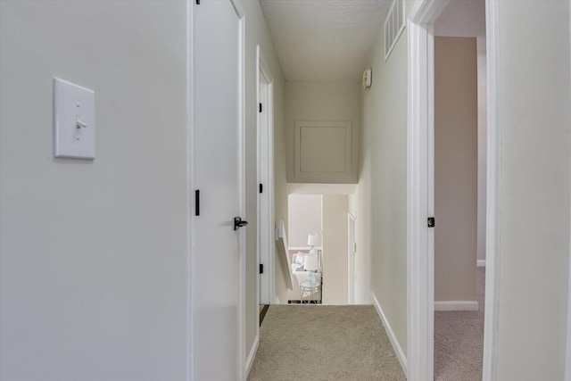 corridor with carpet flooring