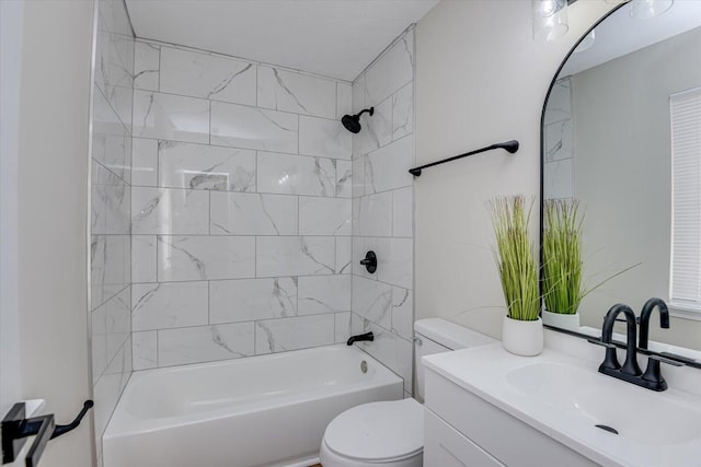 full bathroom featuring vanity, toilet, and tiled shower / bath