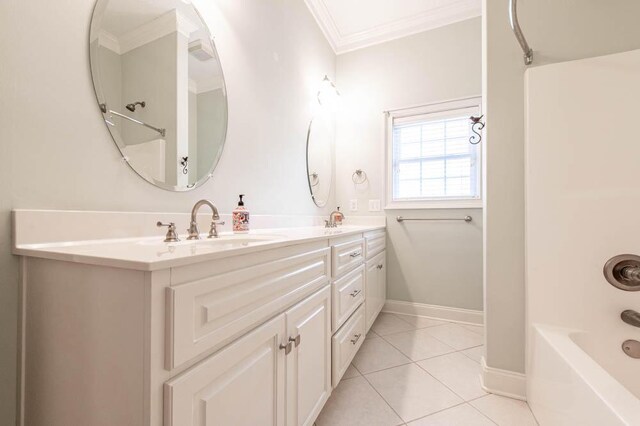 bathroom with crown molding, tile patterned flooring, double vanity, washtub / shower combination, and a sink