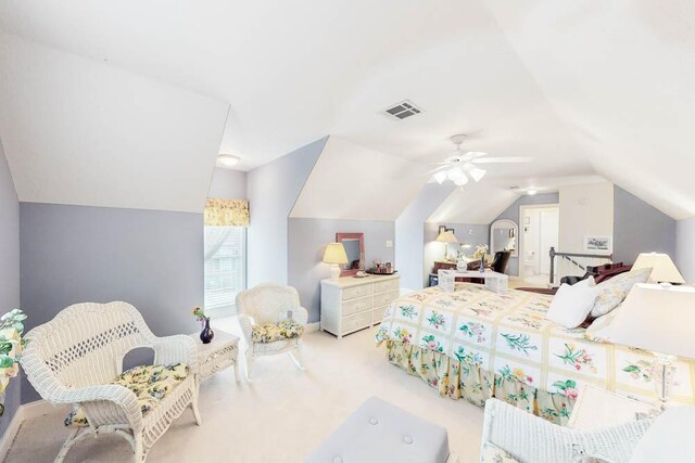 carpeted bedroom with ceiling fan and vaulted ceiling