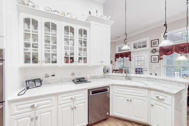 kitchen featuring stainless steel dishwasher, light stone counters, sink, white cabinets, and hanging light fixtures