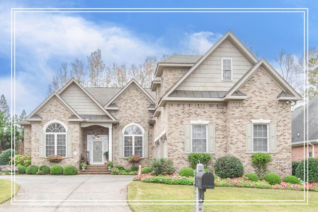 craftsman-style house with a front yard