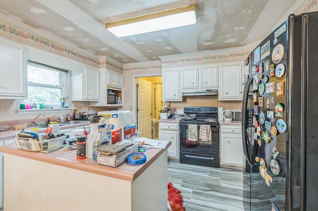 284 Mount Folly Rd, Augusta, GA 30907 - kitchen with black appliances, under cabinet range hood, light countertops, white cabinetry, and crown molding