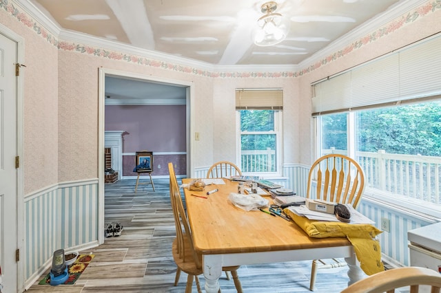 284 Mount Folly Rd, Augusta, GA 30907 - dining room with wood finished floors, ornamental molding, wallpapered walls, wainscoting, and a fireplace