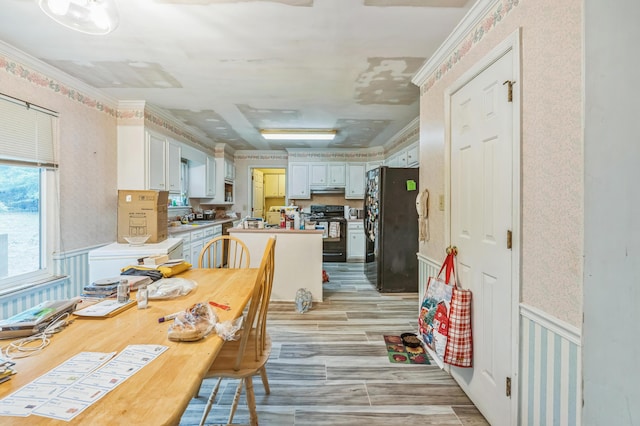 284 Mount Folly Rd, Augusta, GA 30907 - dining area with wallpapered walls, light wood-type flooring, ornamental molding, and a wainscoted wall