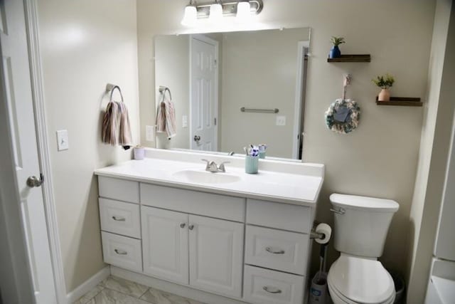 505 Ridgeland Dr, Sandersville, GA 31082 - bathroom featuring vanity and marble look tiles