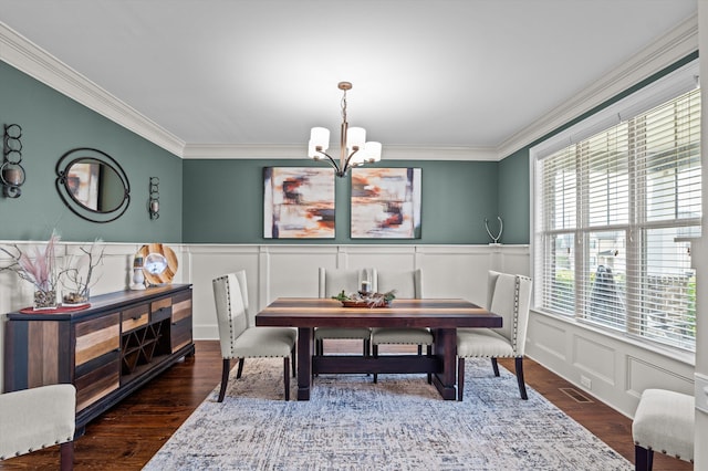 1206 Arcilla Pt, Martinez, GA 30907 - dining area with a chandelier, ornamental molding, a decorative wall, a wainscoted wall, and wood finished floors